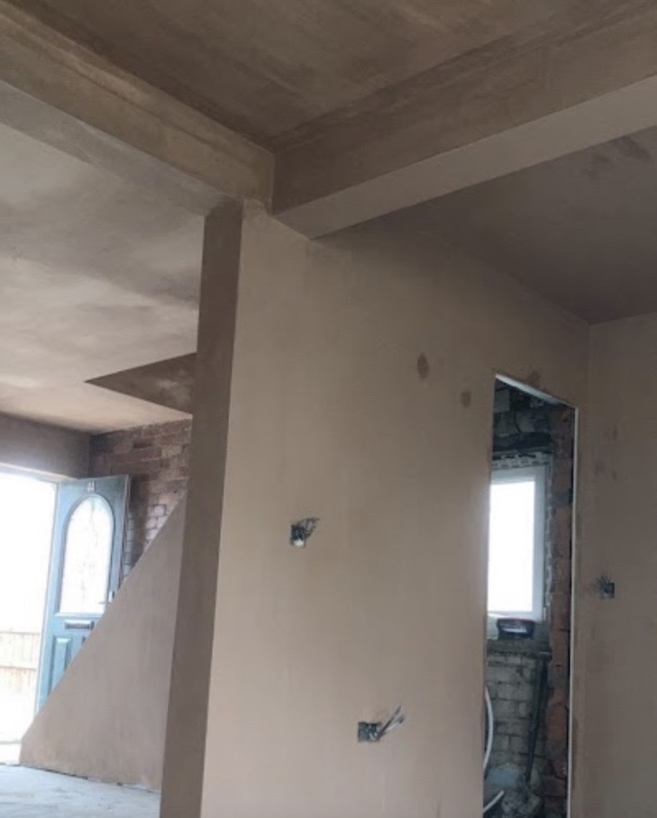 Plastering around doorways and beams in a Dulwich renovation, with detail on tricky surfaces.
