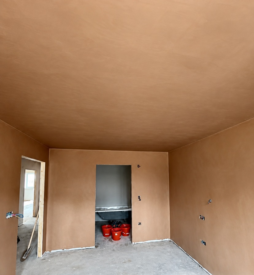 Full-room plaster skimming on the walls and ceiling before decorating in Croydon.